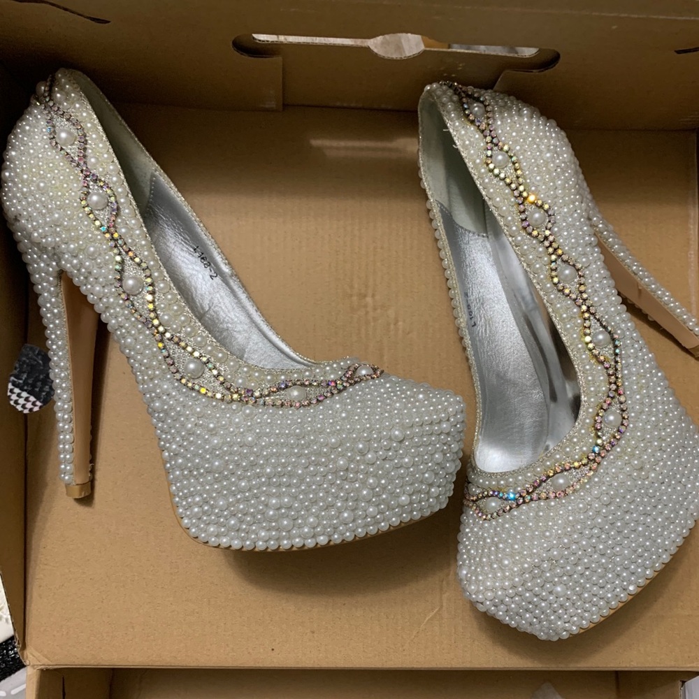 High heels covered in studs/pearls